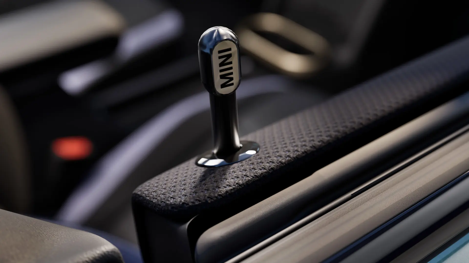 Buton original de blocare pentru portiere MINI, pentru interior, din aluminiu anodizat negru.